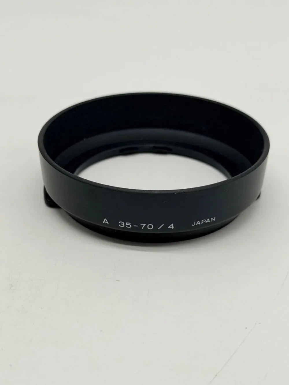 Minolta snap-on plastic lens hood specifically designed for the 35-70mm f/4 AF 